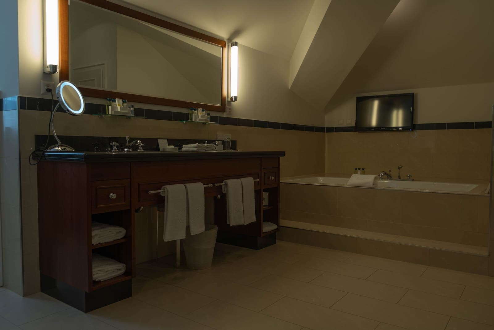 A row of globe bulbs above a bathroom mirror