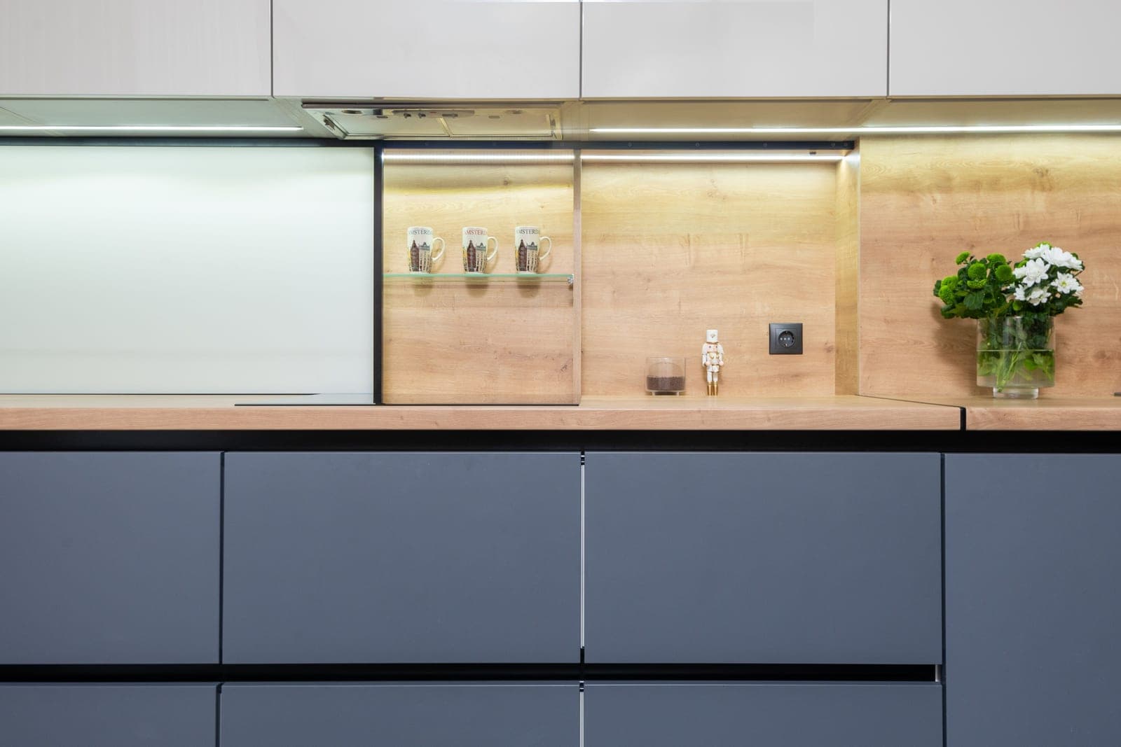 Round LED puck lights mounted under a cabinet