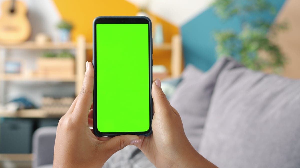 A phone controlling a lamp in a living room