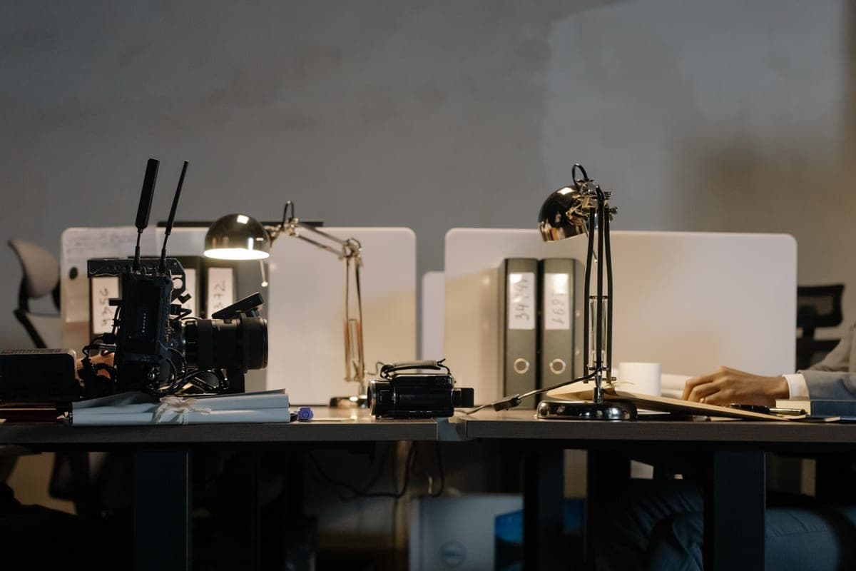 An adjustable desk lamp lighting a work surface
