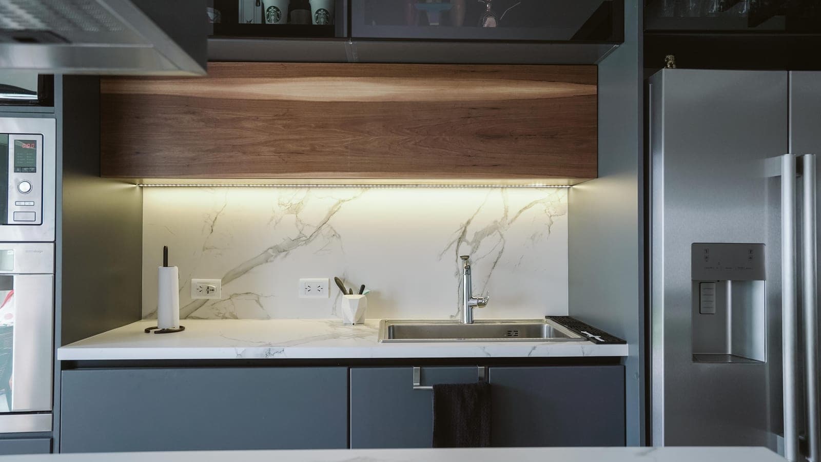 An under-cabinet light bar dimmed to a low level