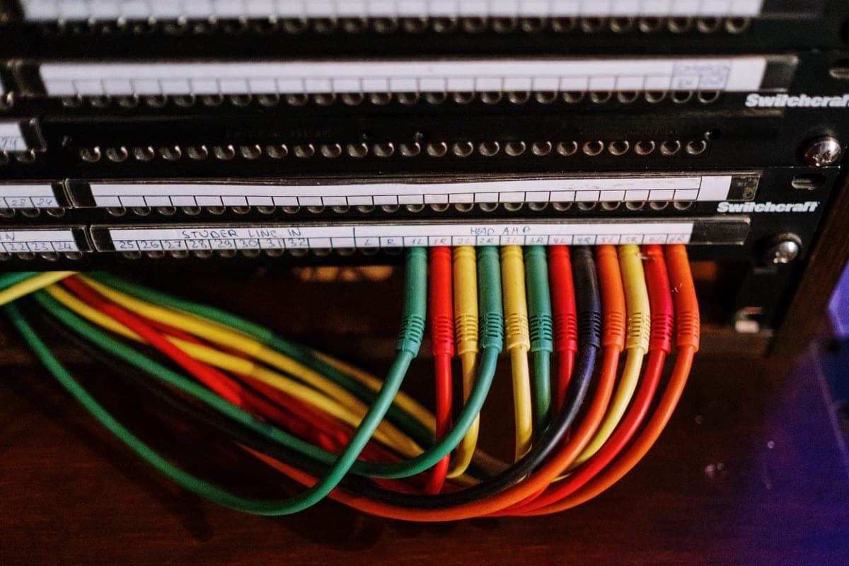A cable neatly routed along a baseboard with clips