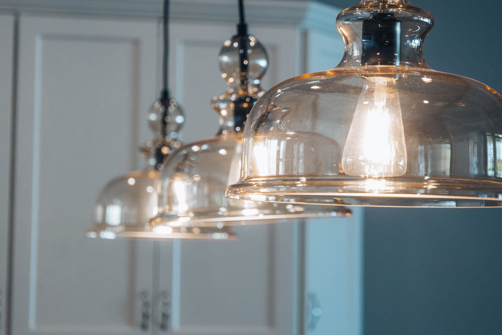 Pendant lights hanging above a kitchen island