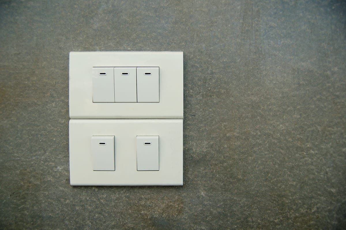 A dimmer switch on a plain wall