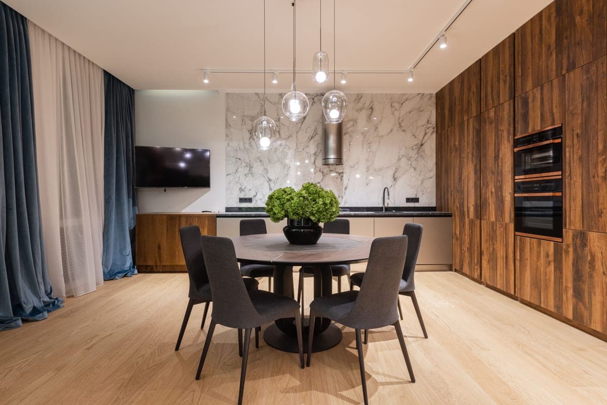 A dining area lit without a ceiling fixture