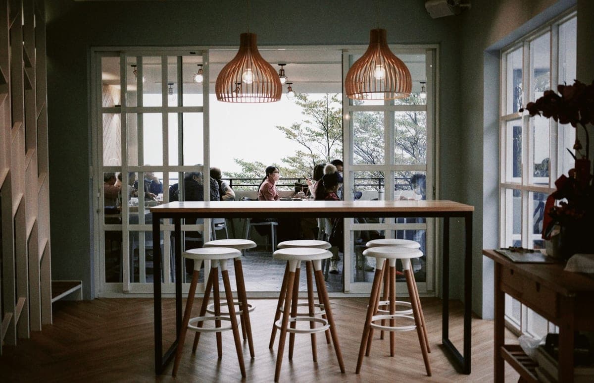 A pendant light hanging above a dining table