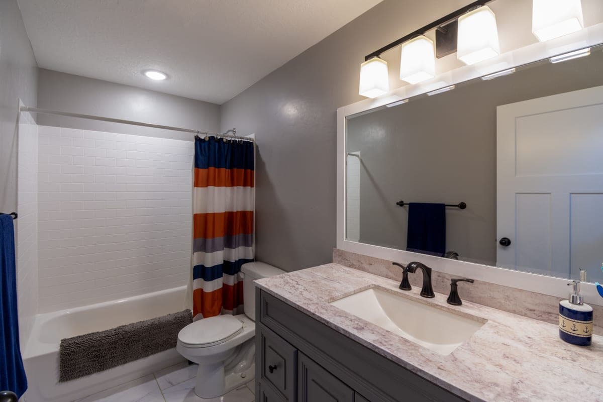 A bathroom mirror lit from the sides