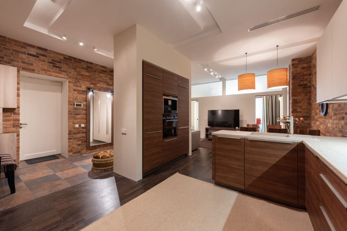 A kitchen with warm lighting over the counters
