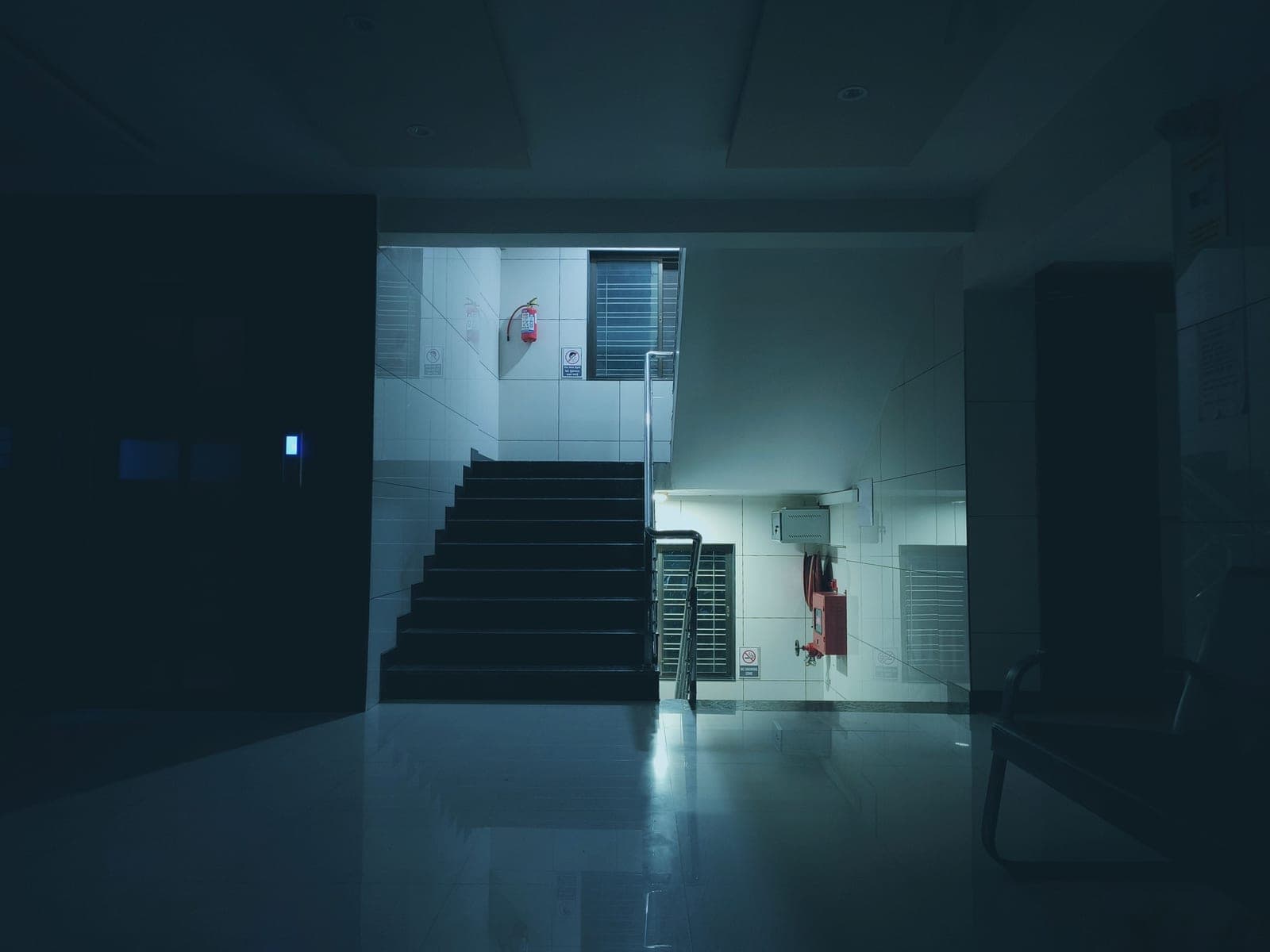 A staircase lit evenly from above and along the treads