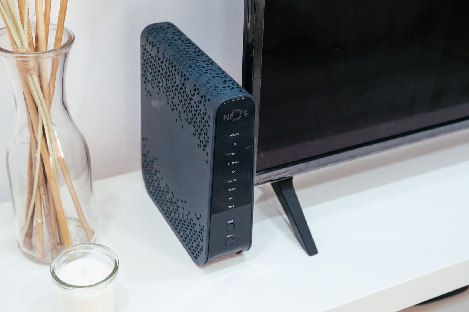 A smart bulb beside a wireless router